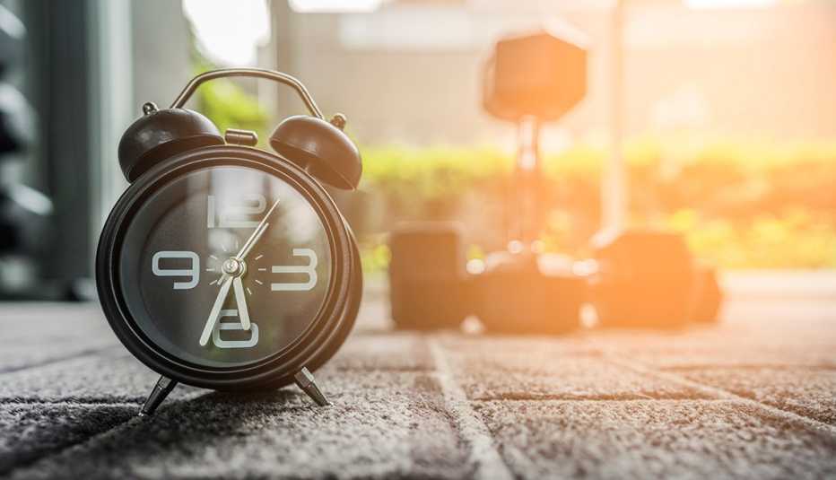 alarm clock and dumbbells