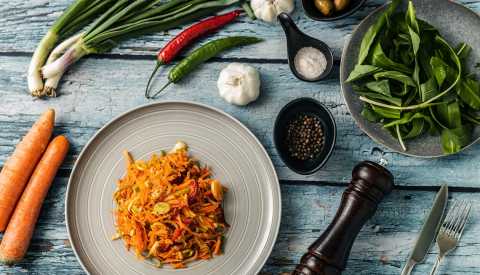 vegetables and spices in dishes and on table