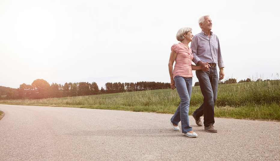man and woman walking outdoors