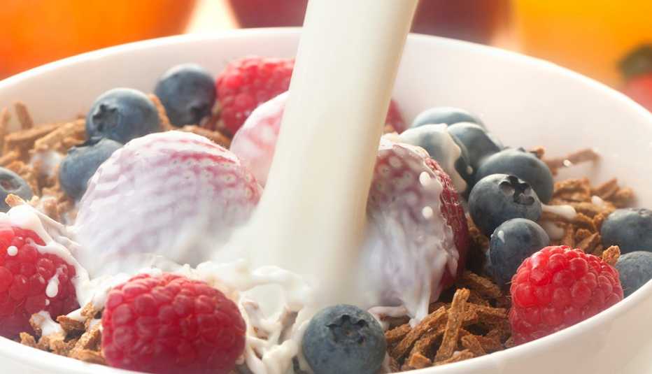 Close up of a bowl of bran cereal with berries. Close up of a bowl of bran cereal with berries.
