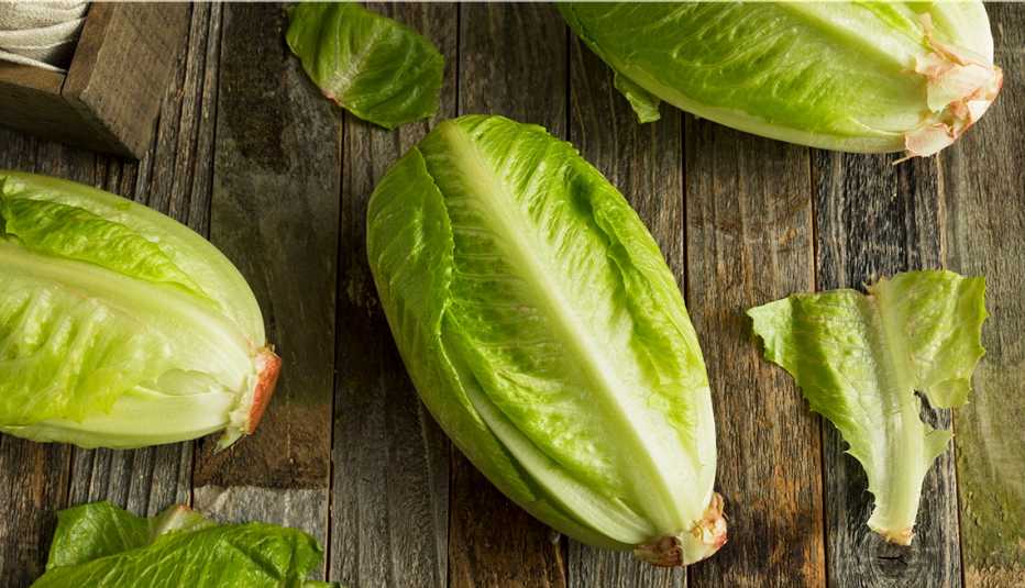 Hearts of romaine lettuce on a wood table