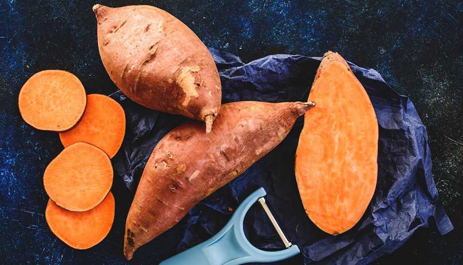 sliced and whole sweet potatoes
