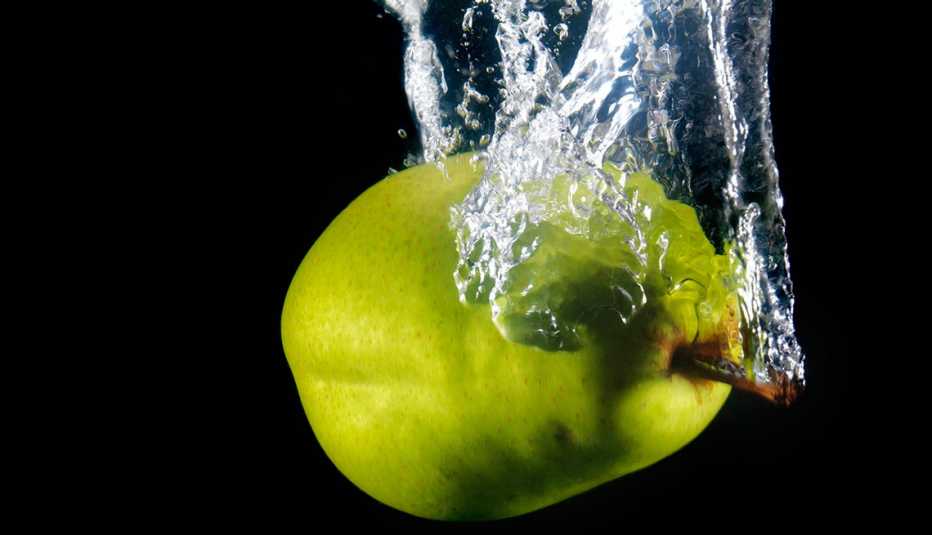 pear dropping into water