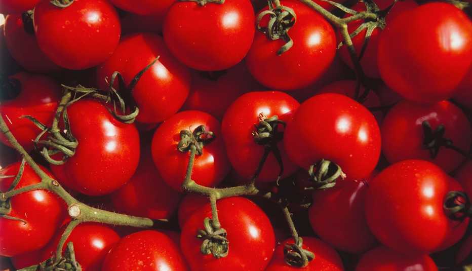 close up shot of tomatoes on the vine