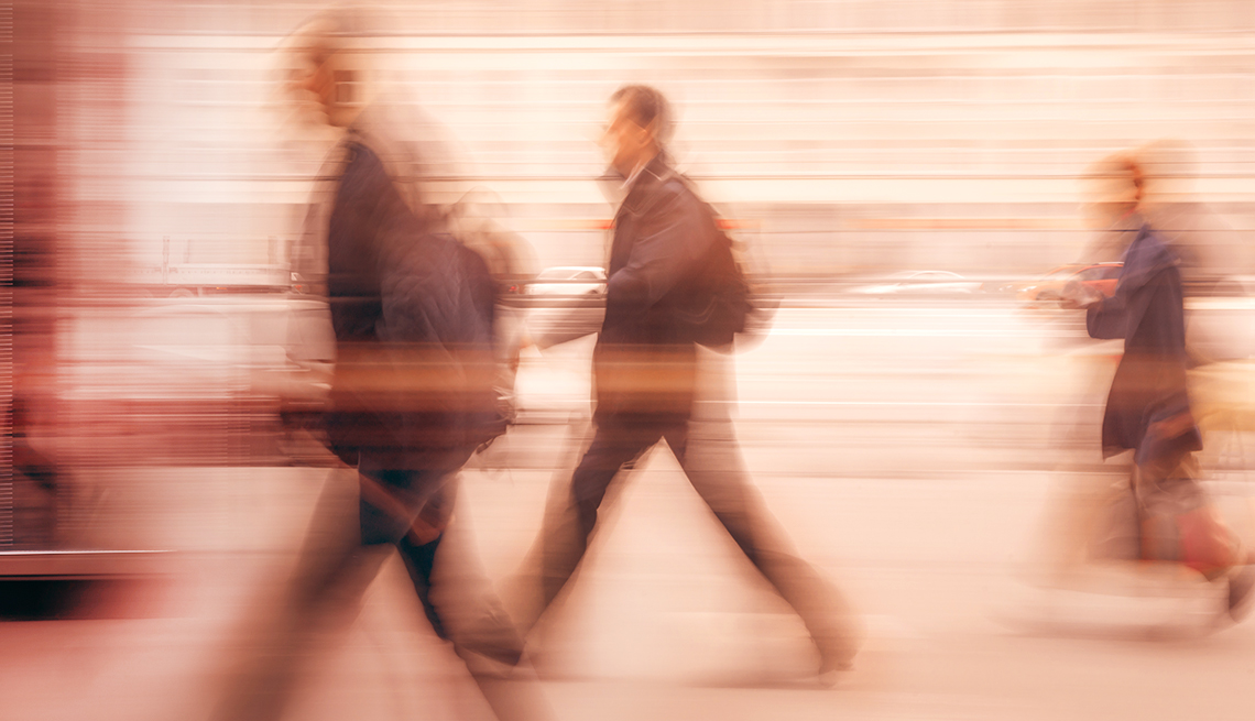 People blurred as the walk in a city 