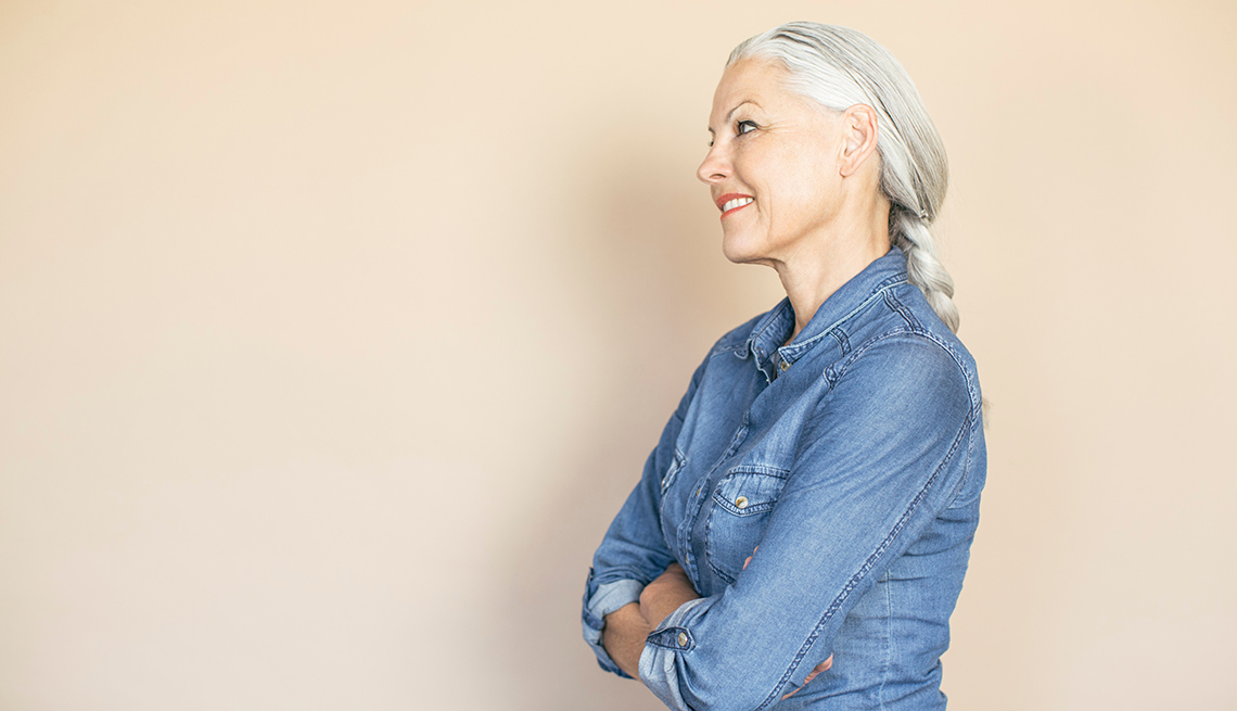 Side Portrait Of A Smiling Middle Aged Caucasian Woman Against Pink Background, Great Things About Getting Older