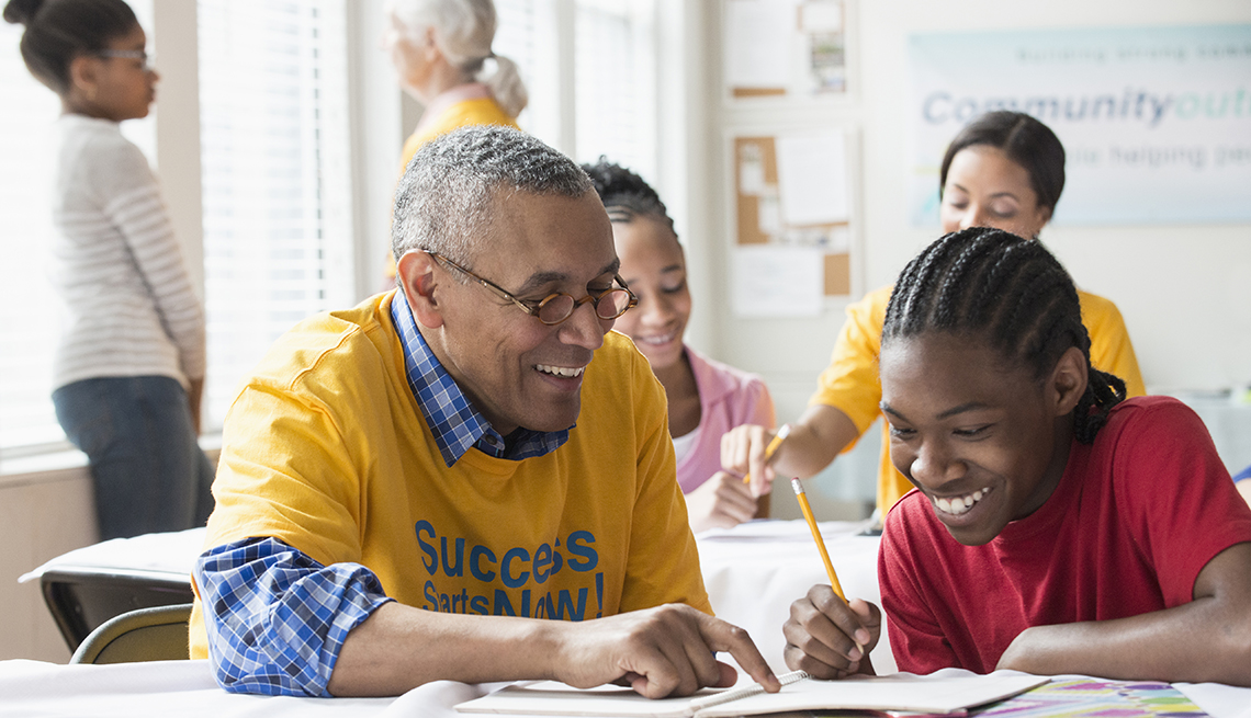 volunteers tutoring students in classroom