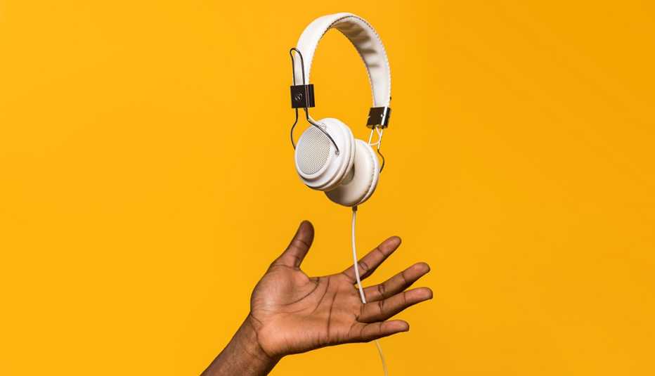 man doing balance with suspended headphones