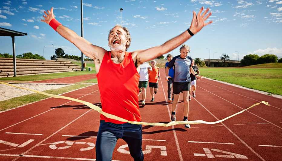 man crossing finish line