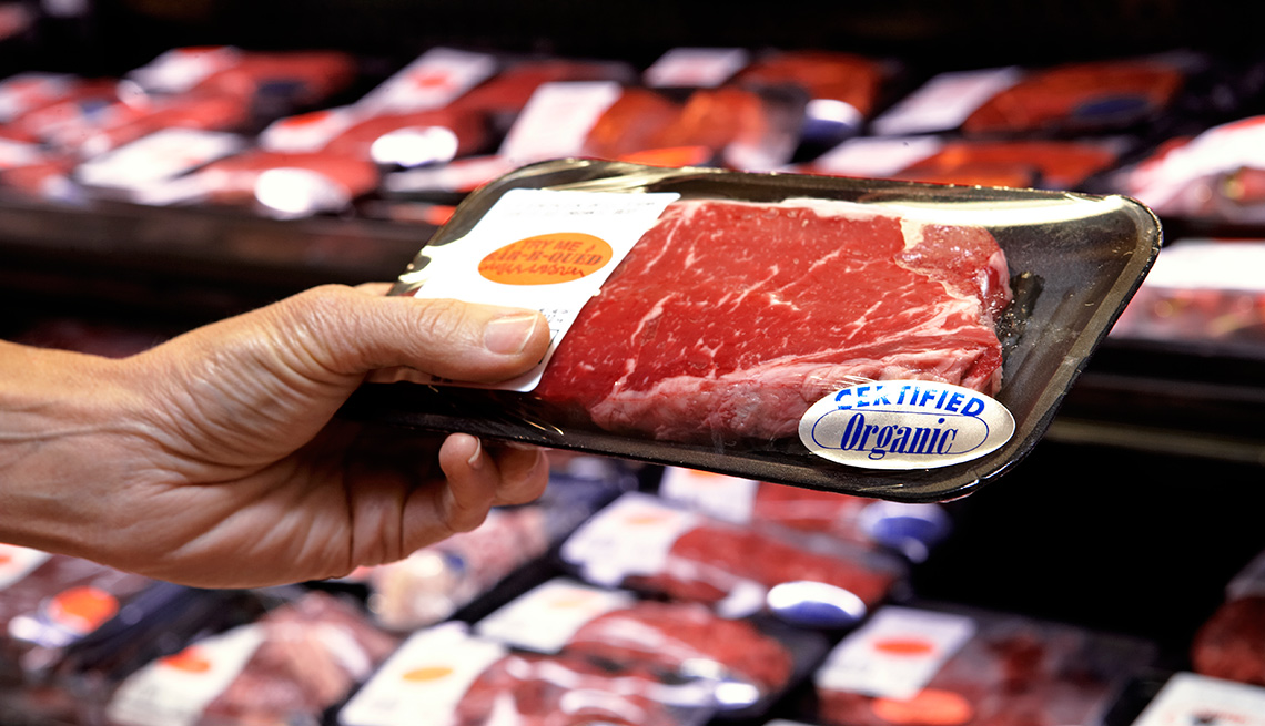 Man holds red meat