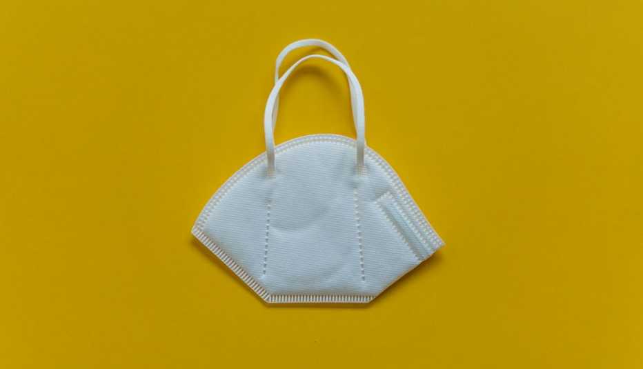 n95 mask on yellow background