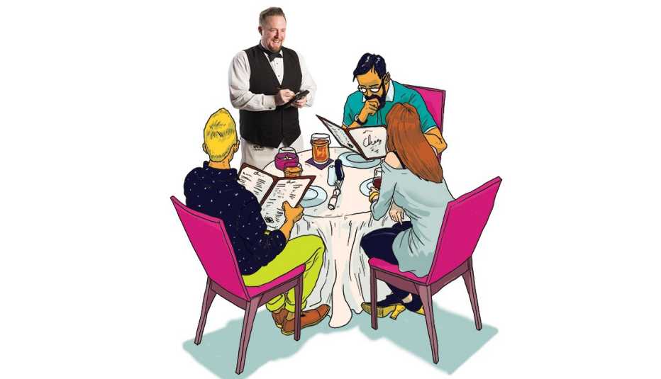 waiter takes an order from a table of diners 