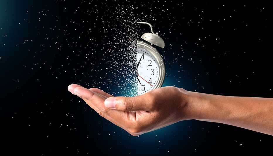 concept of passing away, a clock sitting in a man's hand breaks down into pieces