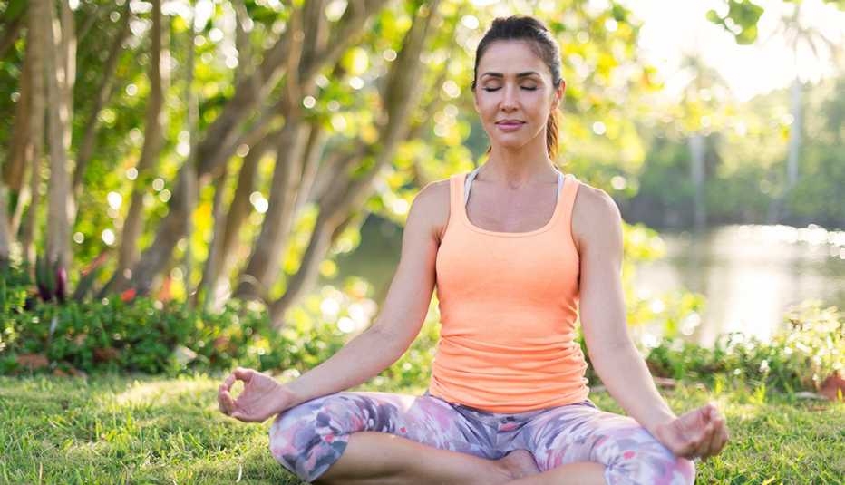 Woman meditating in the park