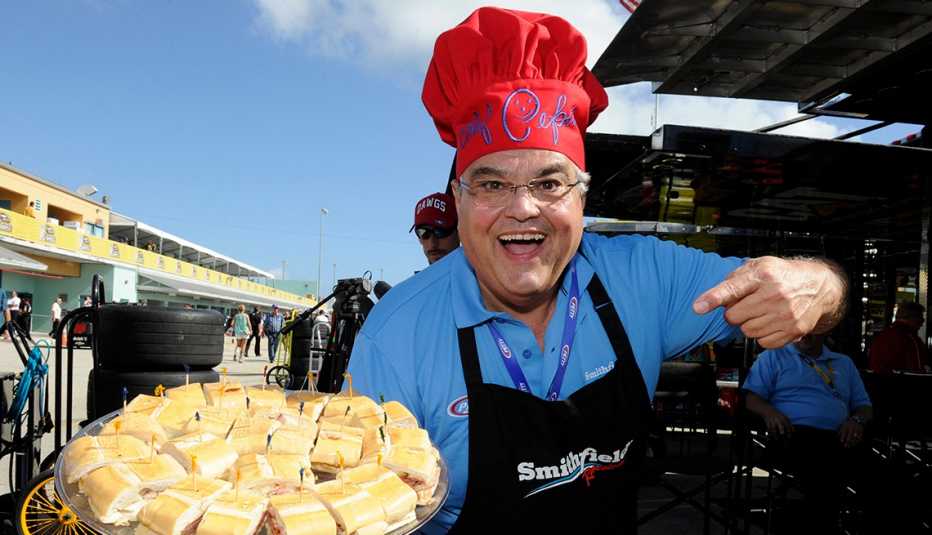 Chef Pepin holding a plate of food.