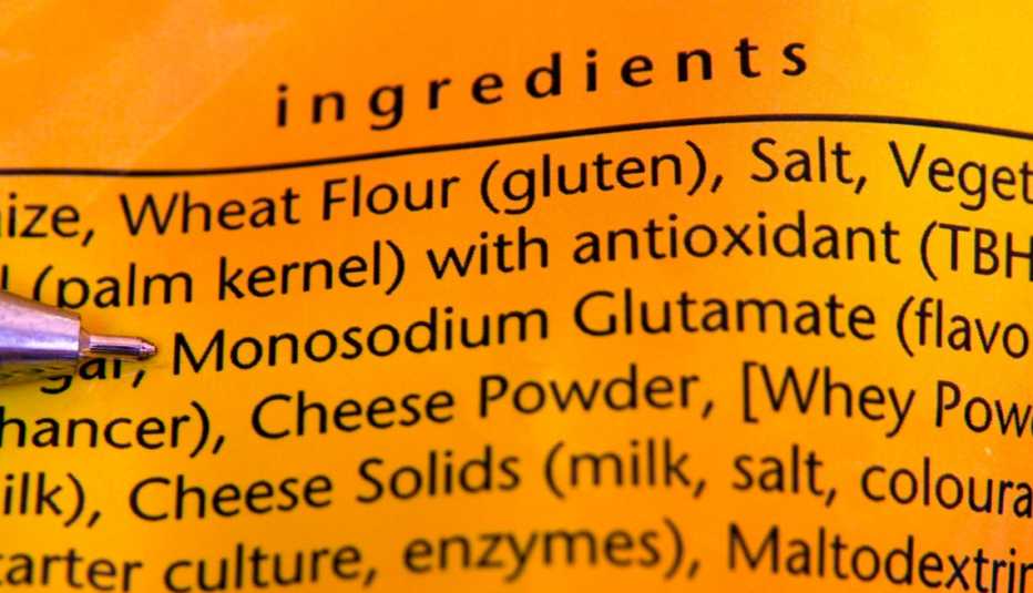 pen pointing at monosodium glutamate in the ingredient list of a bag of chips