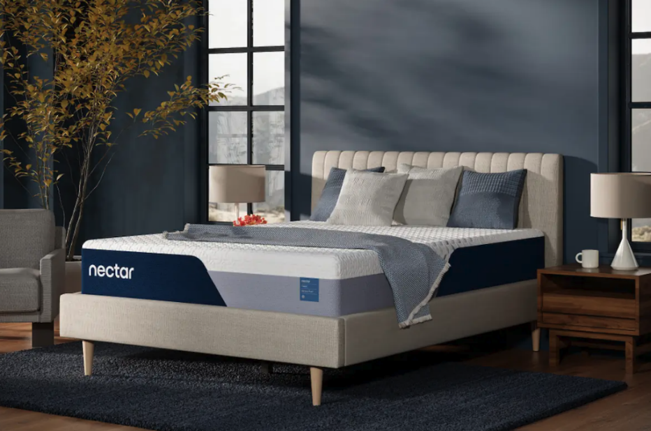 The Nectar Classic Hybrid mattress in a blue bedroom.