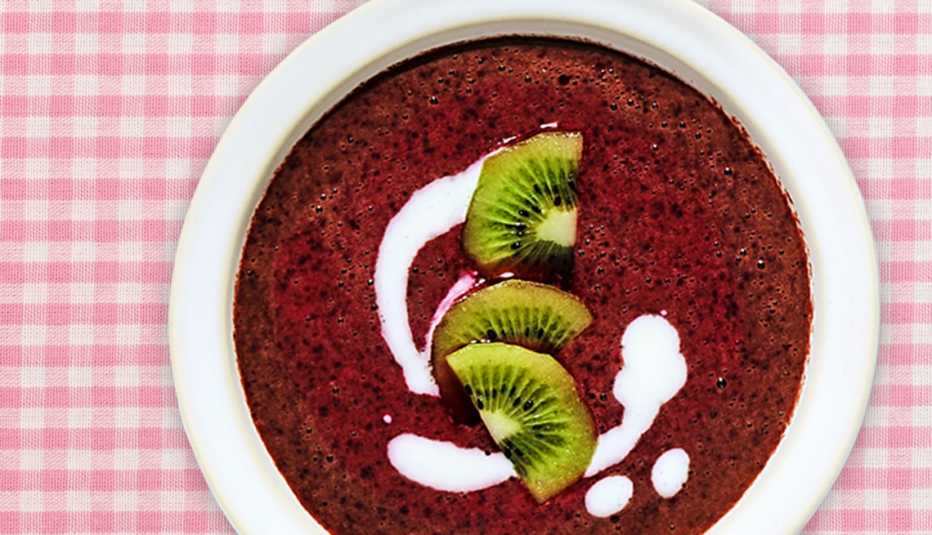 bowl of no-cook blueberry-orange soup on a table bowl of no-cook blueberry-orange soup on a table