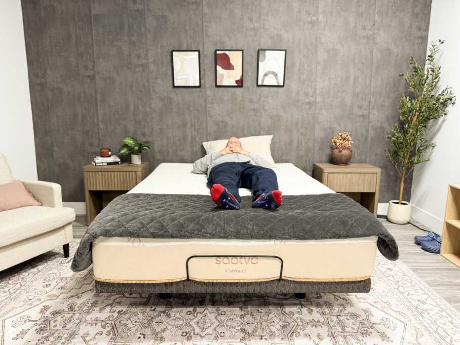 A man lying on his back on the Saatva Contour5 mattress.