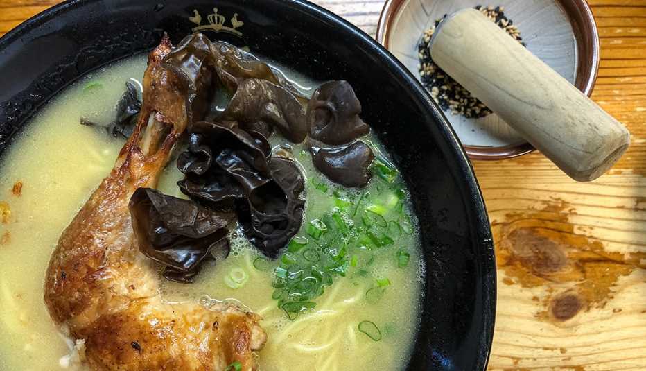 bowl of ramen noodles with mushrooms and chicken