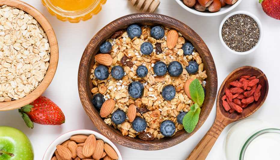 granola with nuts and raisins, blueberries, dried goji berries, chia seeds and yogurt