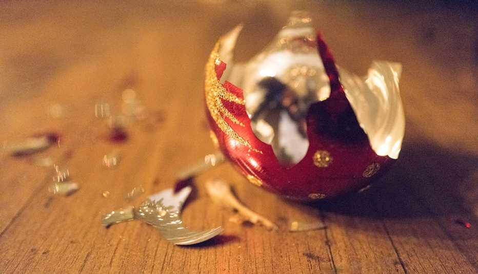 broken Christmas ball on wooden floor