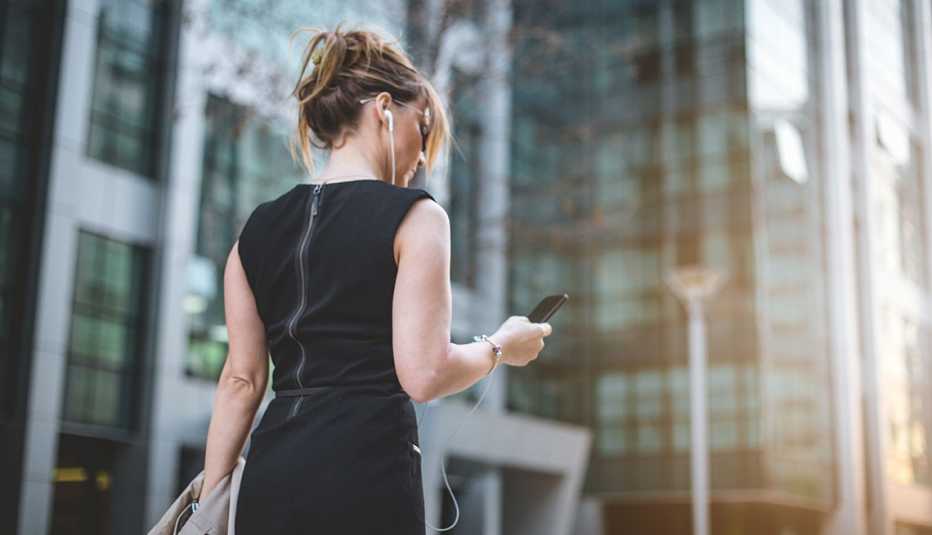 Woman listening to music while walking