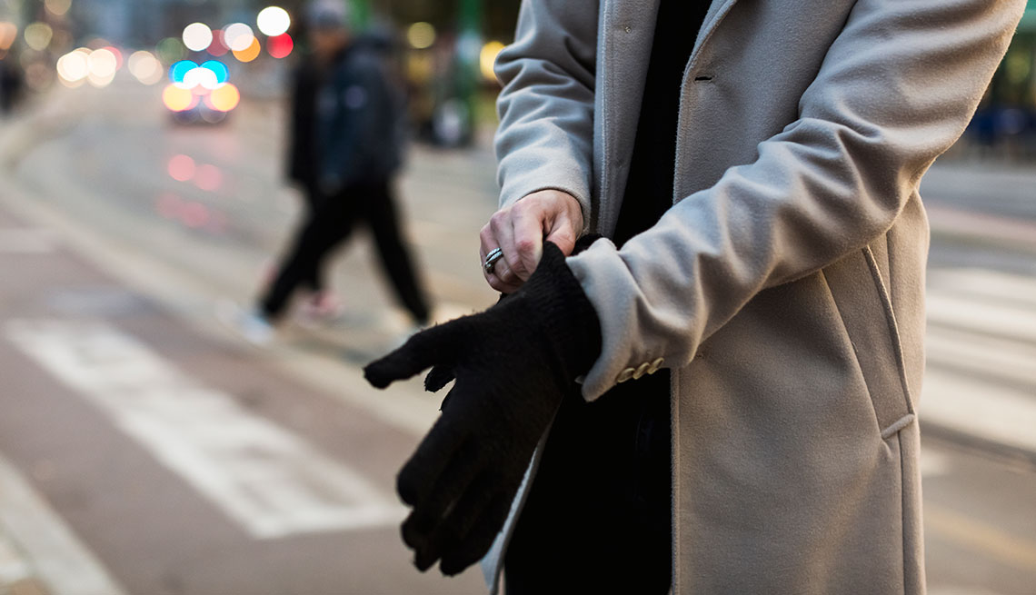 a man putting on gloves 
