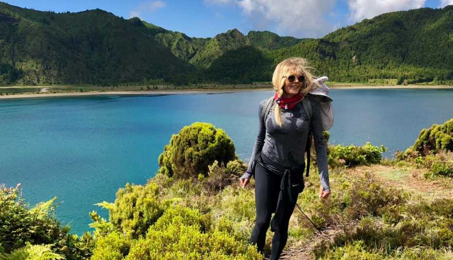kathy smith hiking on the shore of a beautiful lake