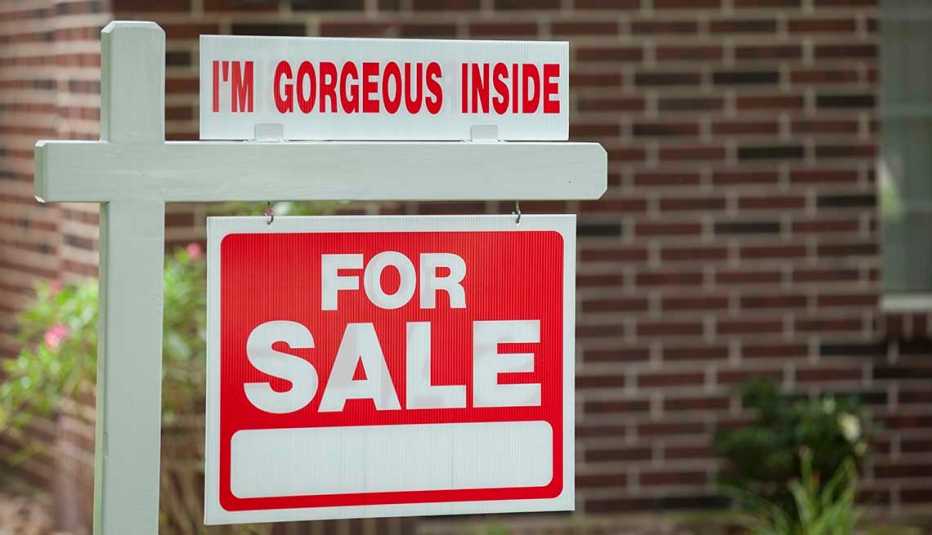 Real estate sign in residential neighborhood.  Moving house, relocation concepts.