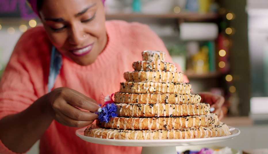 Nadiya Hussain puts the finishing touches on a dessert in Nadiya Bakes