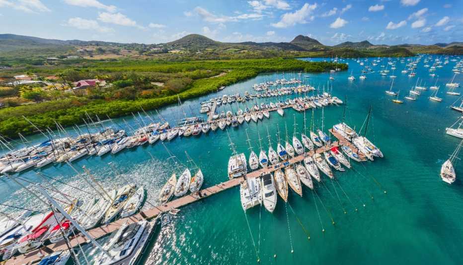 beautiful sunlit overhead photo of a boat filled harbor on the tropical island of martinique