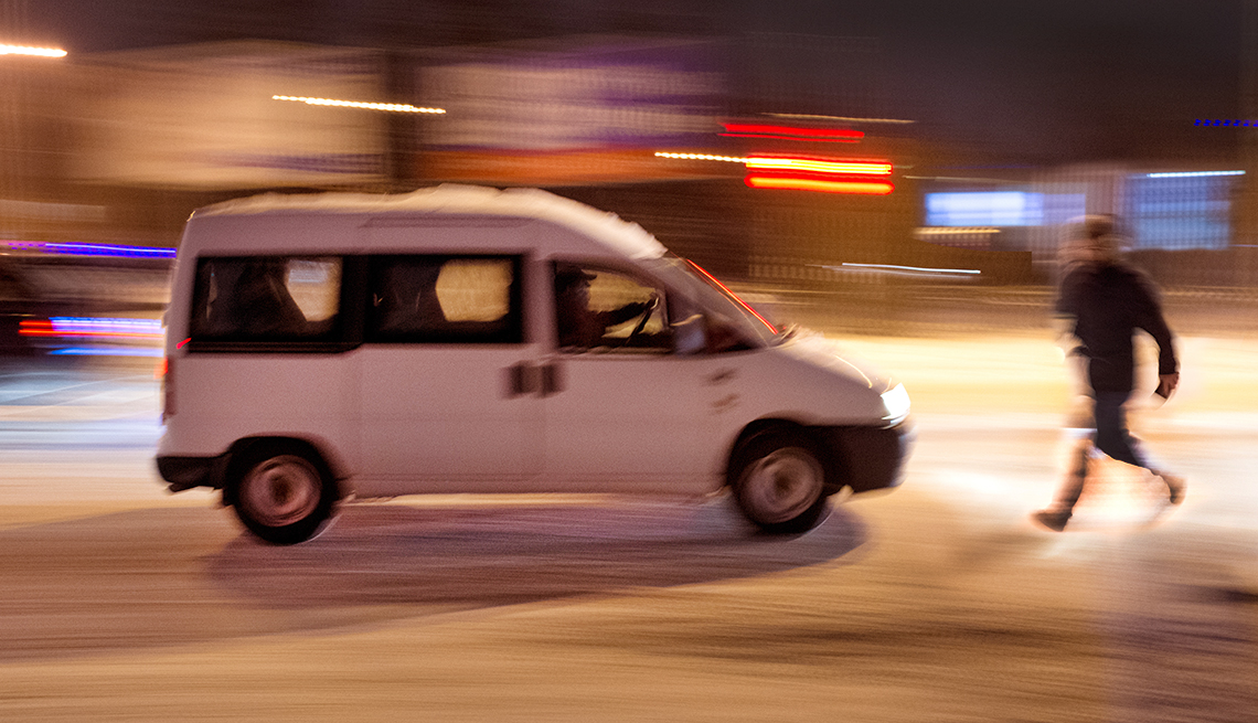 Pedestrian running across road 