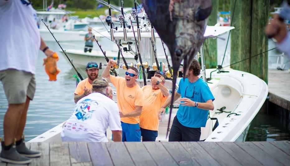 fishermen celebrate on their boat