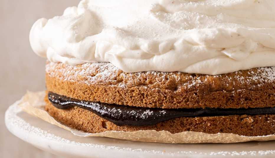 cake with dark filling and fluffy white topping
