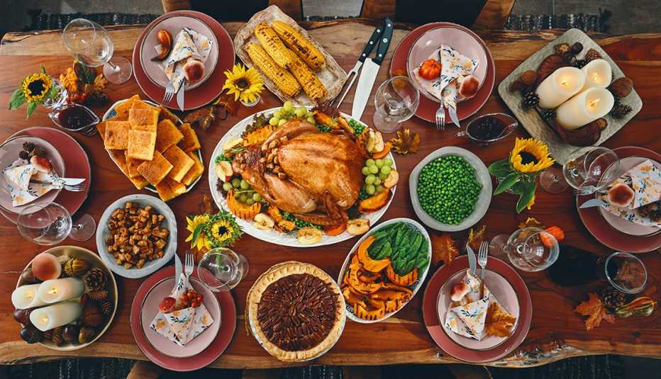 a table full of various Thanksgiving dishes