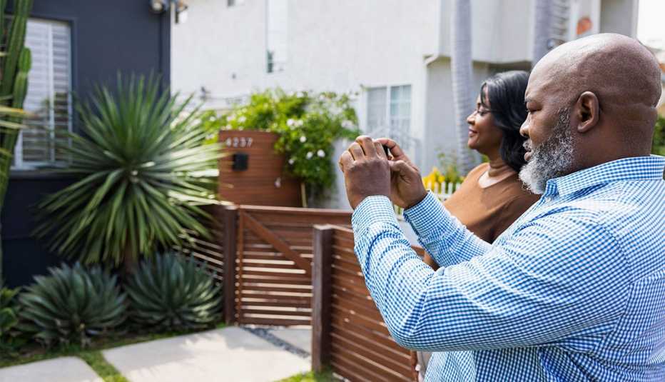 a couple thinking of selling their home take photos