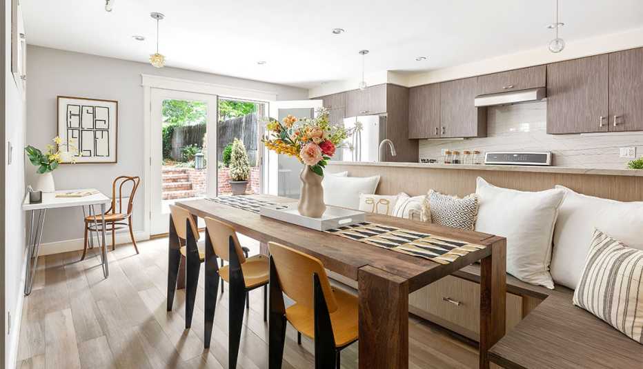 a staged home at four zero eight tenth street showing a kitchen and dining area a staged home at four zero eight tenth street showing a kitchen and dining area