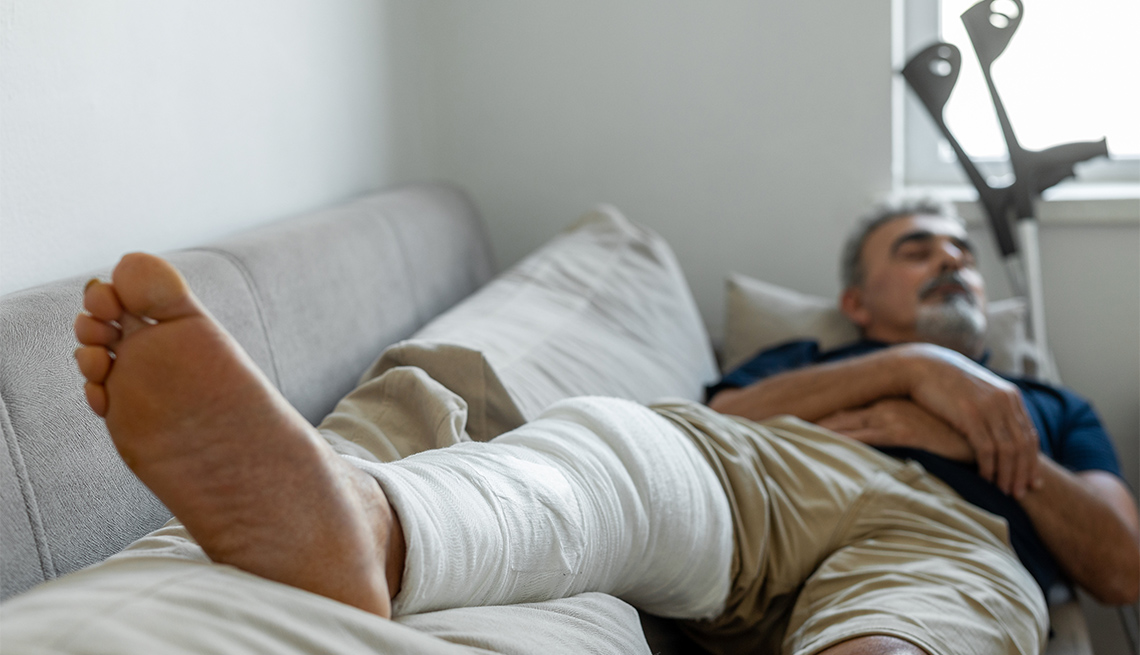 Man's leg uses crutches to walk after surgery