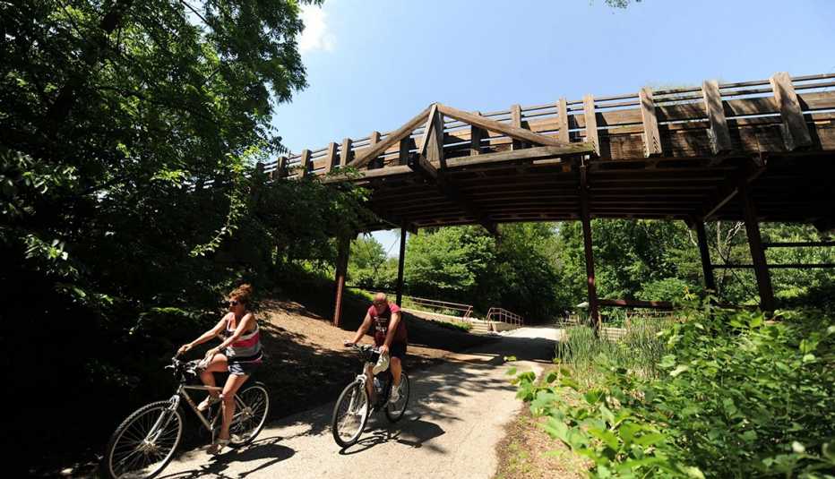 people riding bikes on a trail