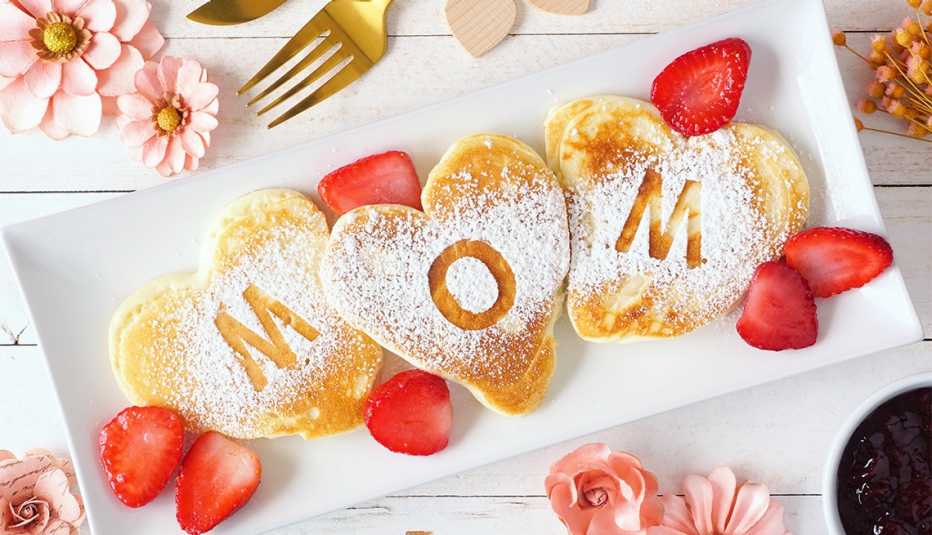 Heart shaped pancakes with MOM letters on them