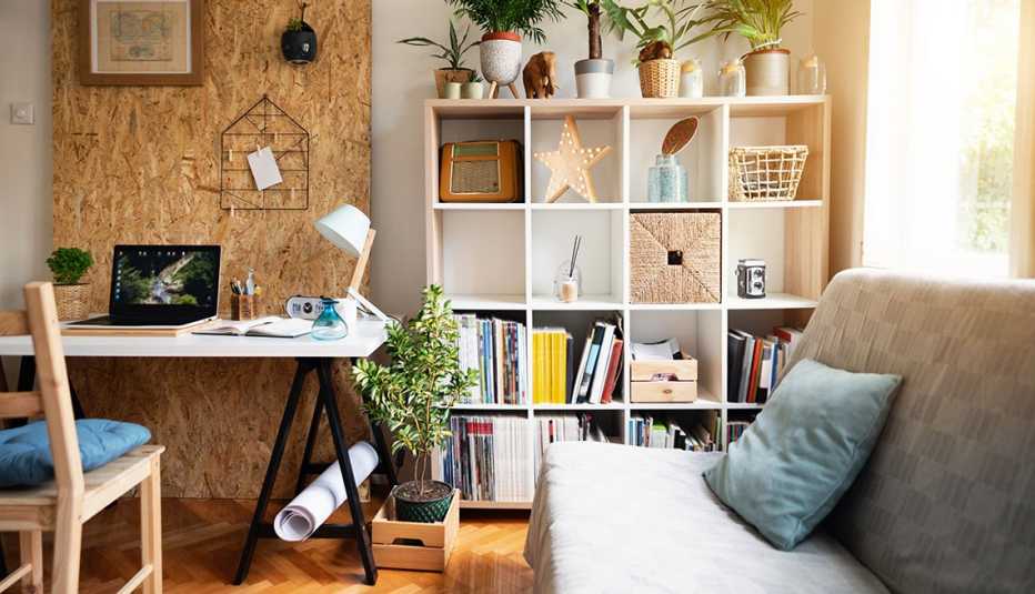 an office with a desk, chair and bookshelf, indicating organization