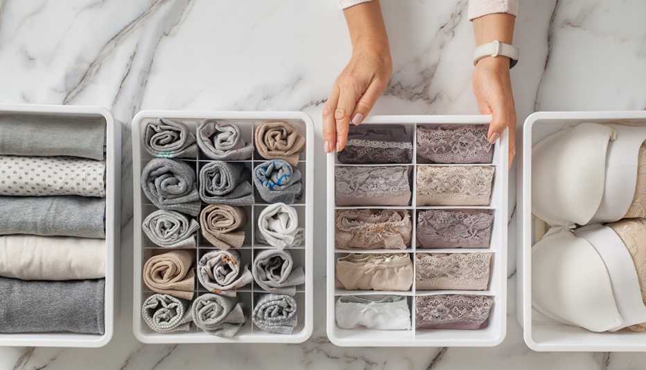 woman organizing items to go in an underwear dresser drawer