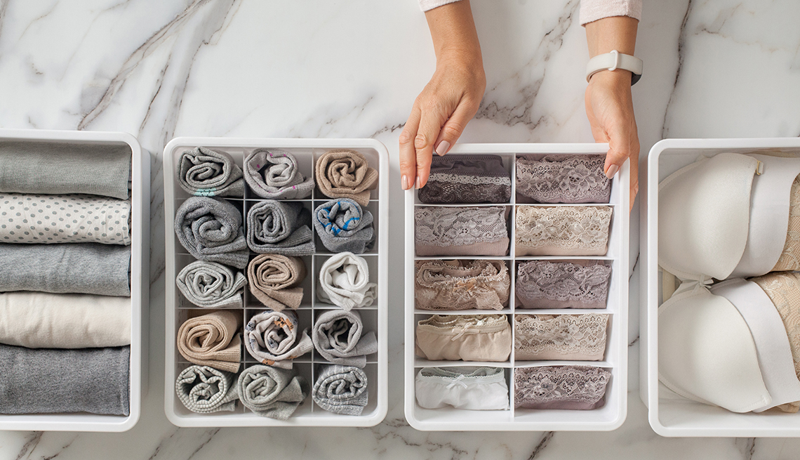 woman organizing items to go in an underwear dresser drawer