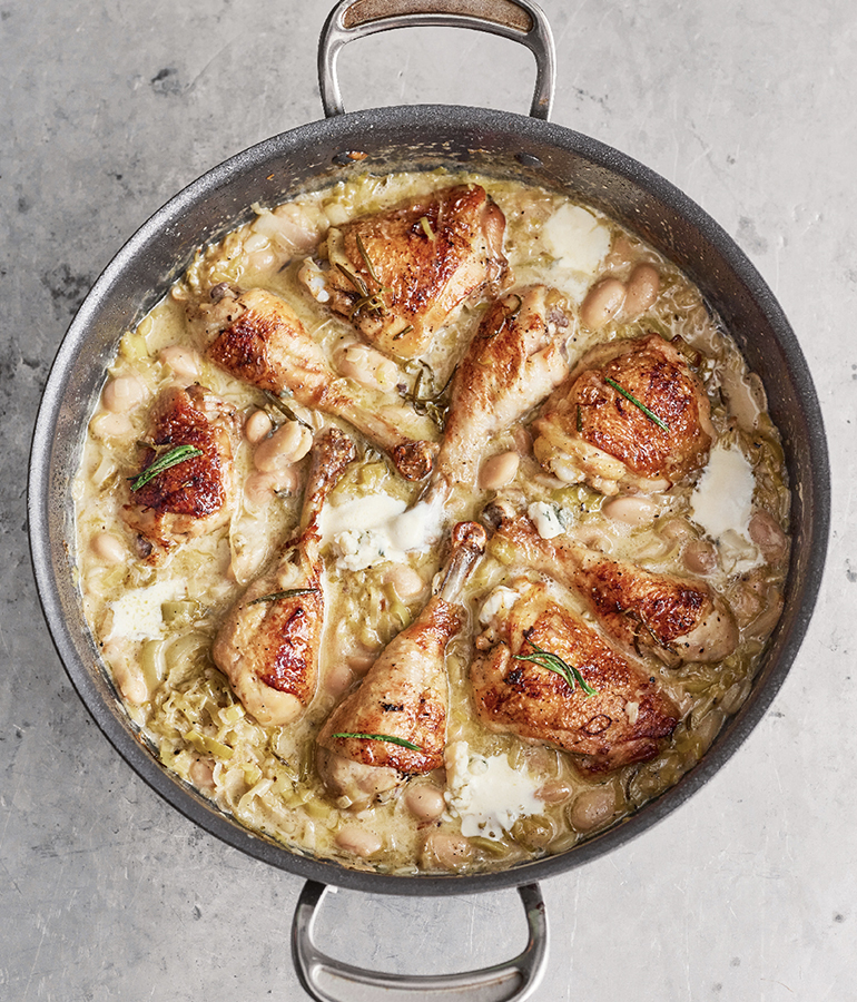 chicken thighs and drumsticks covered in sauce in a pan chicken thighs and drumsticks covered in sauce in a pan