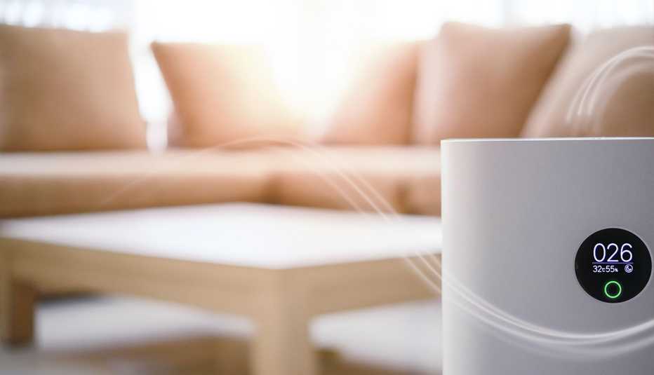 air purifier with couch and coffee table in background