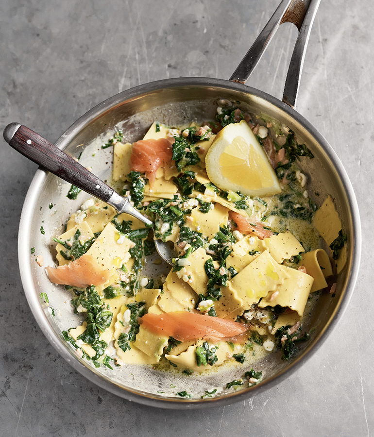 salmon, pasta, lemon and spoon in pan salmon, pasta, lemon and spoon in pan