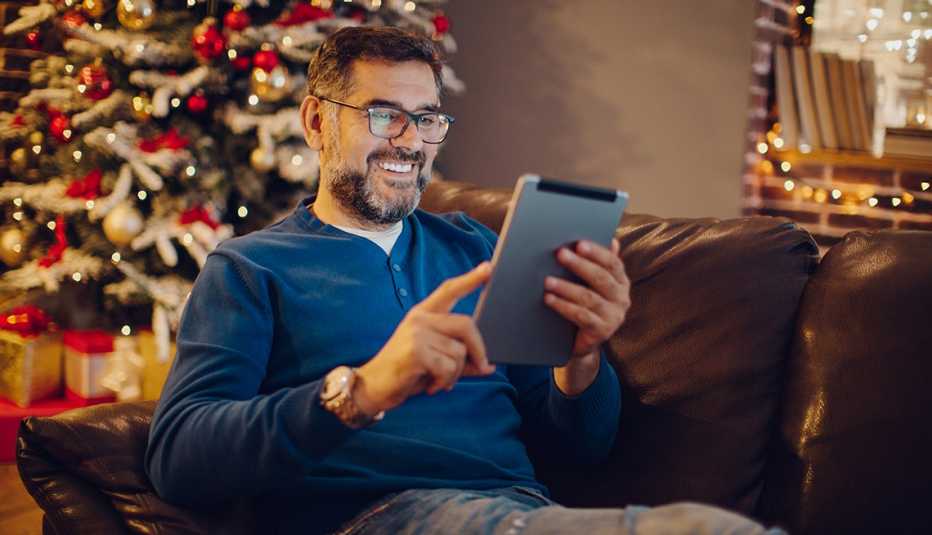 Man on tablet on Christmas Day
