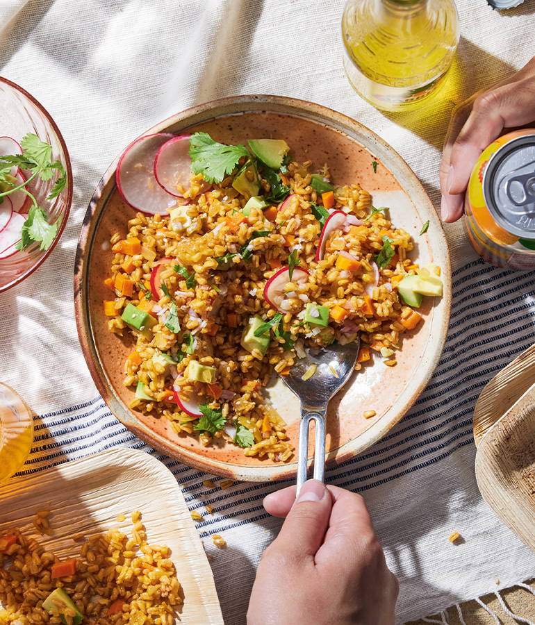 dish with carrot-farro salad, which includes farro, carrots, onions, radishes and avocado pieces