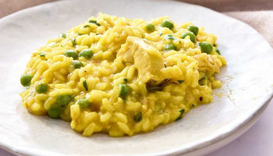 Spring Saffron Risotto with Chicken excerpted from 'Everyday Delicious' by Rocco DiSpirito Risotto with chicken on plate